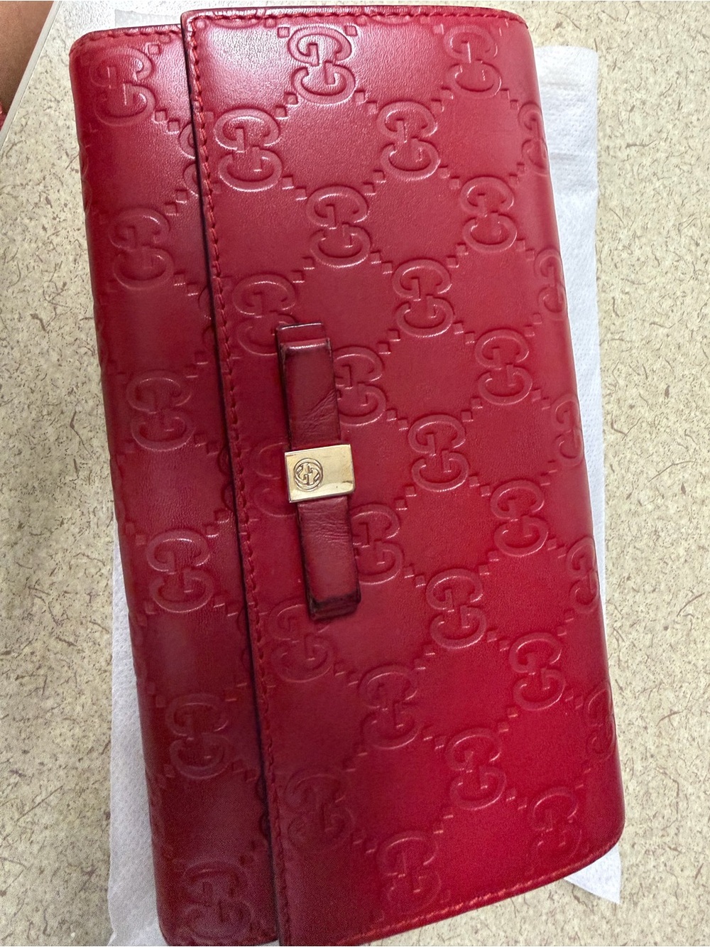 Gucci red embossed GG leather continental wallet with bow clasp